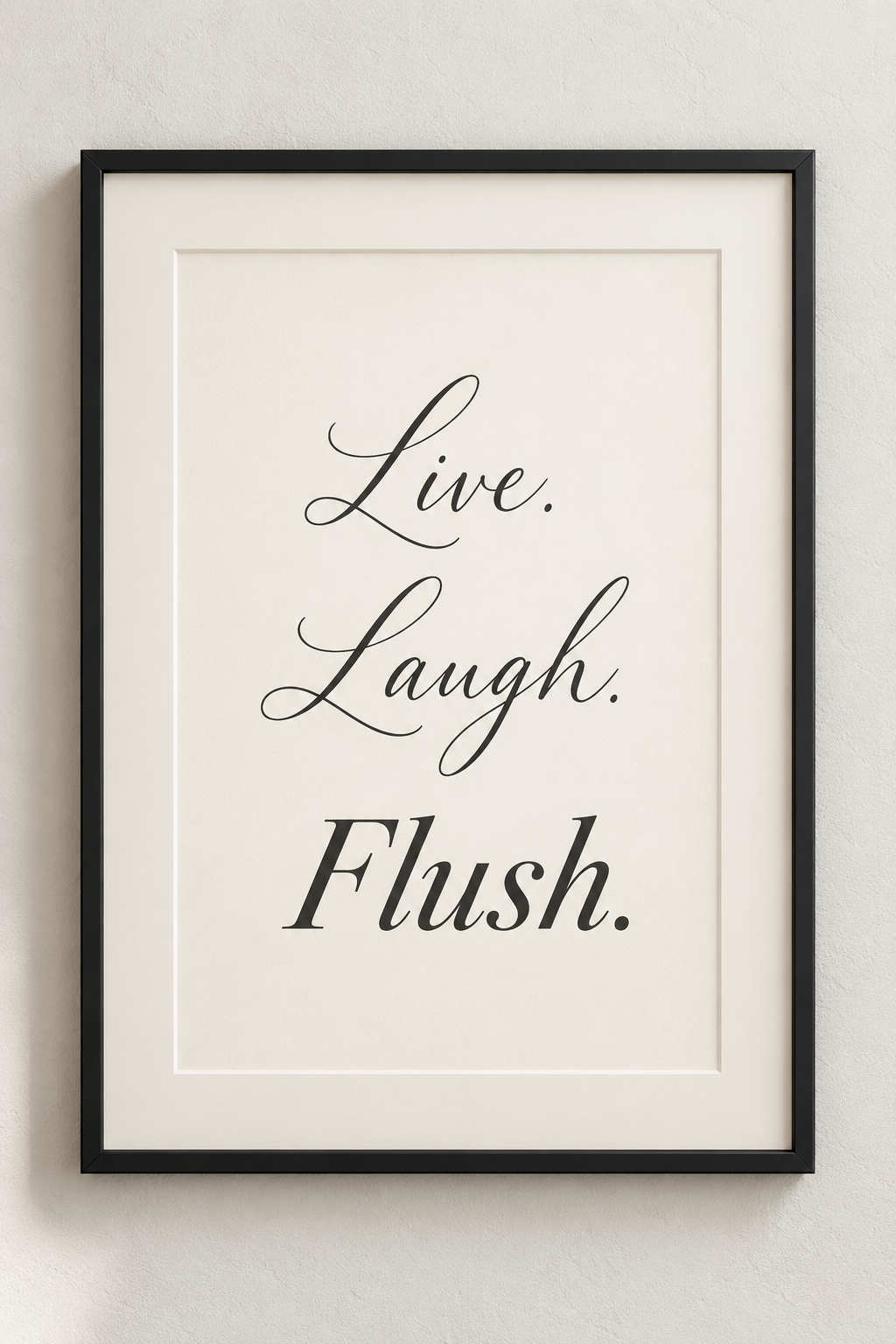 Black-framed ivory bathroom print reading Live. Laugh. Flush.