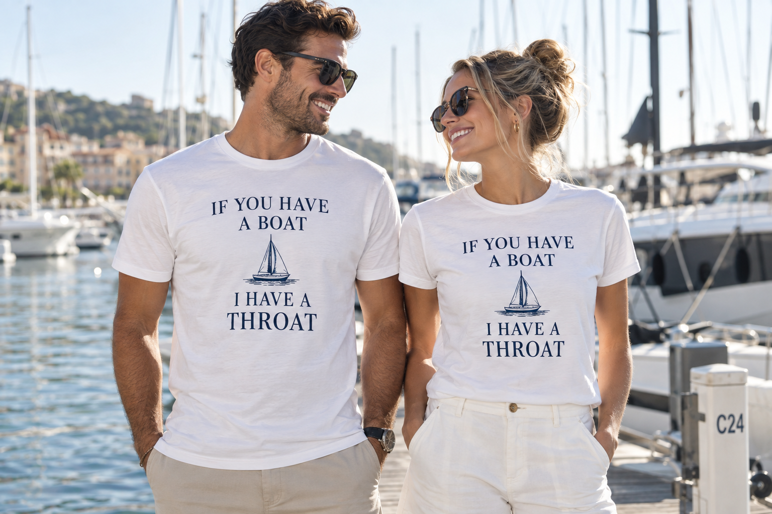 Two adult models at a marina wearing white shirts reading If you have a boat I have a throat in navy lettering with a sailboat